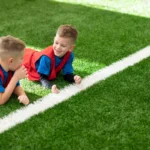 medium-shot-children-laying-grass